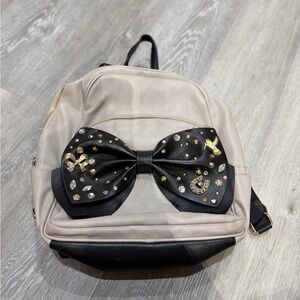 Betsey Johnson Zip Backpack
Beige Leather Black Bow Book
Bag